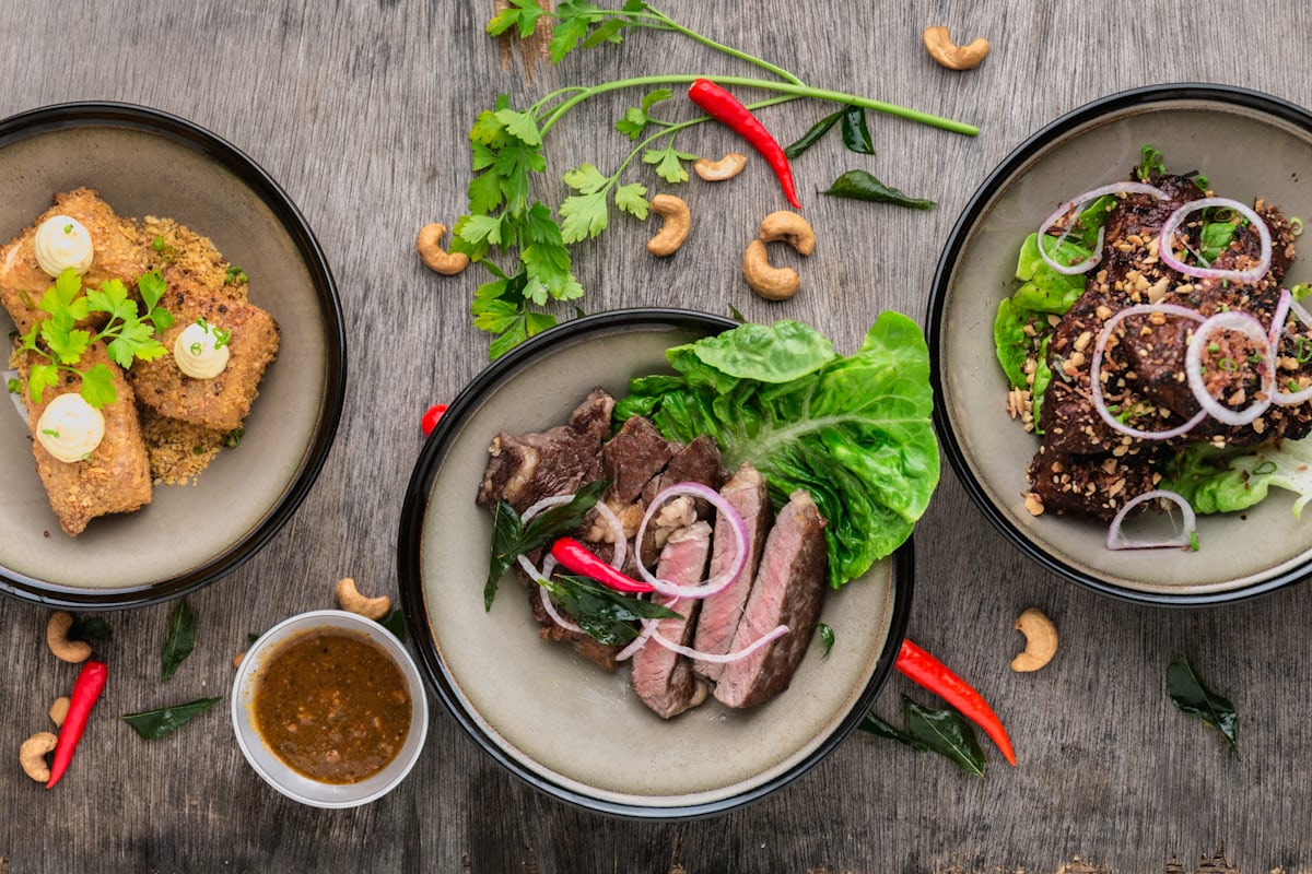 A spread of freshly plated restaurant dishes seen from above